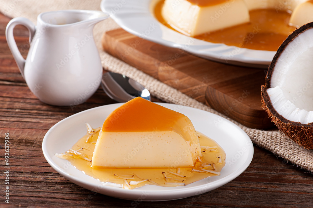 Fototapeta premium Delicious condensed milk and coconut pudding on a white plate.