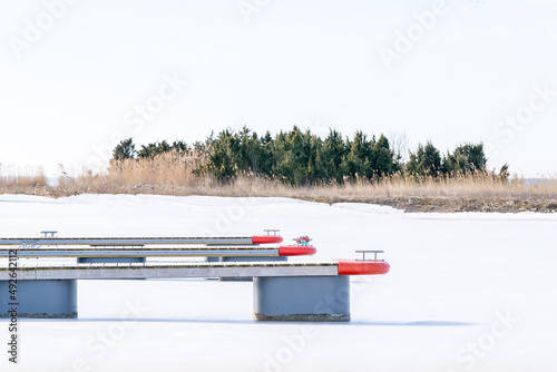 Early spring ice remains and the boat slips are embpty  in early March at the harbour in Orjaku. photo