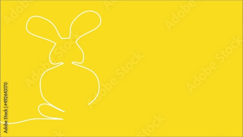 One line video of easter bunny drawn on yeallow background photo