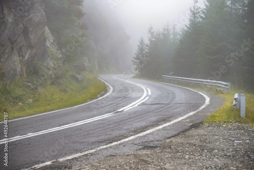 Winding road and fog. Dangerous road. Dangerous driving conditions meteo