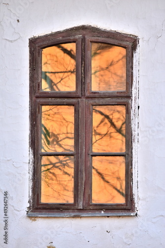 Old window with orange reflection