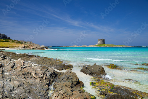 Fototapeta Naklejka Na Ścianę i Meble -  Beautiful panoramic view of Pelosa Beach (Spiaggia Della Pelosa). Stintino. La Pelosa beach, probably the most beautiful beach in Sardinia, Italy. Popular travel destination. Mediterranean seacoast.