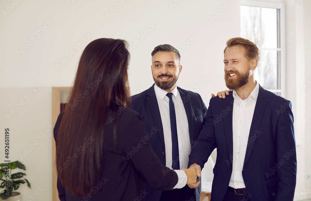 Diverse smiling businesspeople shake hands get acquainted greeting at business negotiations. Happy partners or colleagues handshake close deal or make agreement. Partnership concept. Diverse smiling businesspeople shake hands get acquainted greeting at business negotiations. Happy partners or colleagues handshake close deal or make agreement. Partnership concept.