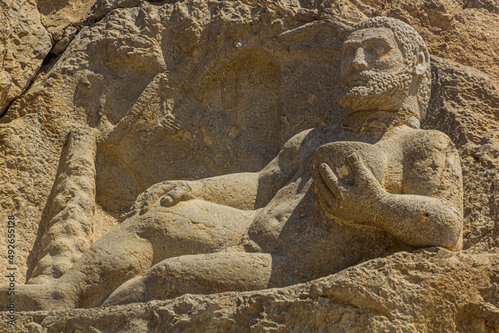 BISOTUN, IRAN - JULY 13, 2019: Ancient statue of Hercules in Bisotun, Iran