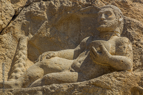 BISOTUN, IRAN - JULY 13, 2019: Ancient statue of Hercules in Bisotun, Iran