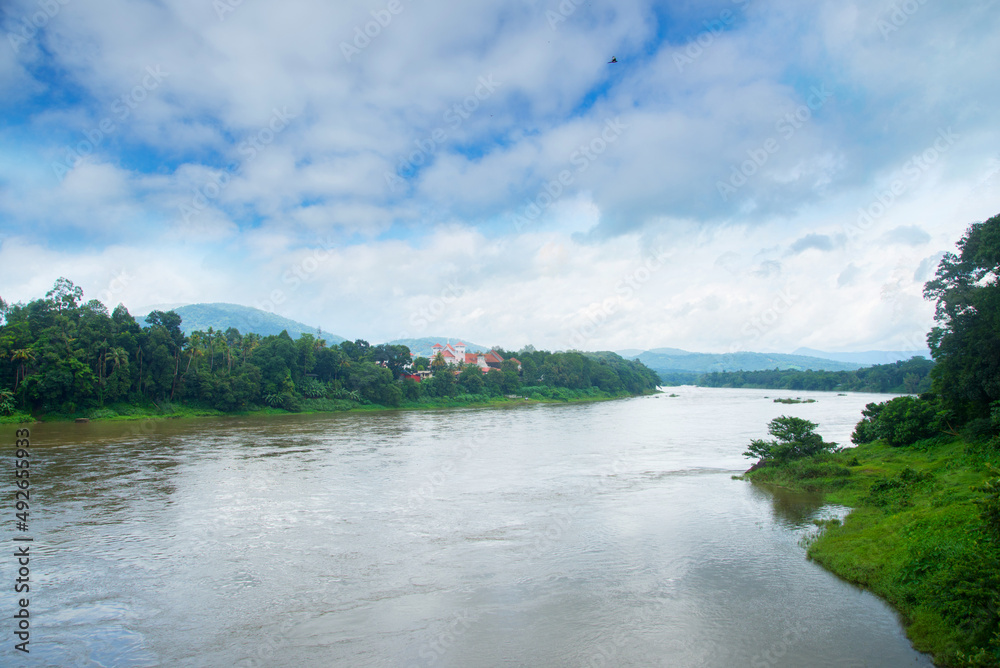 Summer riverscape with blue sky, Nature photography, River landscape Image Kerala India