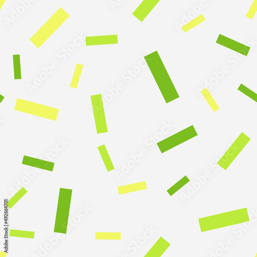 Seamless pattern with confetti. Abstract geometric pattern with green and yellow confetti. Random, chaotic background with cute confetti.