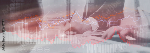 Finance Banking and Investment concept. Double exporsure stacked of coins and city with graph photo