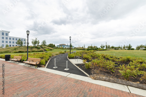 A paved walking path leads into RCA Pier Park, an urban revitalization project on the Delaware River waterfront in Camden, New Jersey, USA