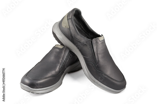 Black leather shoes isolated on white background. Full depth of field. Close-up.