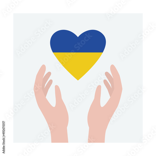 Hands holding heart with Ukraine flag colors. Peace for Ukraine.