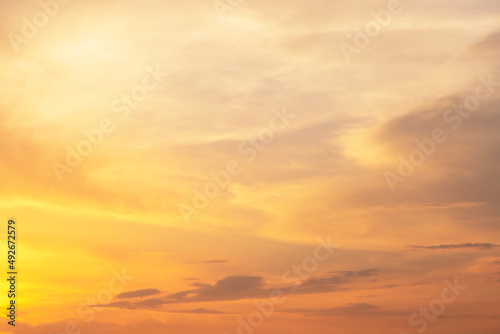 Bright  colorful sky during sunset. Orange  yellow  golden colors of clouds. summer mood time