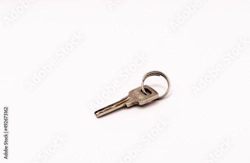 Key with keyring isolated on white. © Sulugiuc