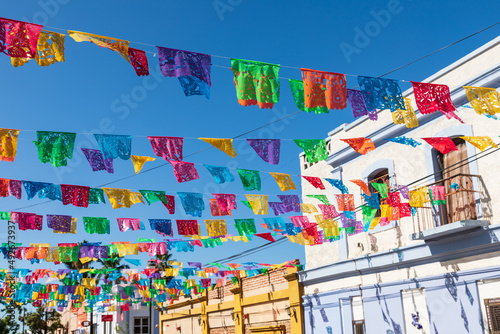 Festive colorful banners over a street in Todos Santos. photo