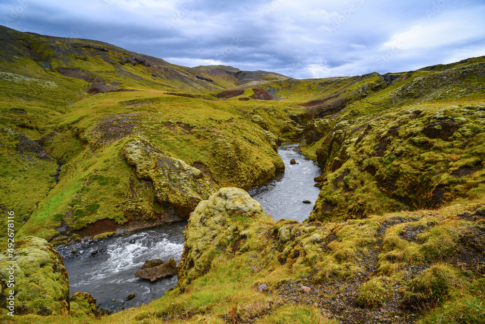 A river cutting through the beautiful volcanic landscape on the trek from Skógafoss up to the Fimmvörðuháls hut and pass, south Iceland A river cutting through the beautiful volcanic landscape on the trek from Skógafoss up to the Fimmvörðuháls hut and pass, south Iceland