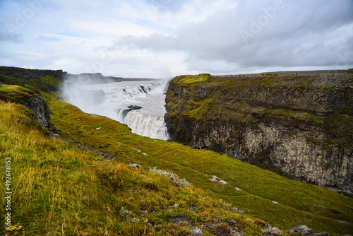 Gullfoss waterfall, on the so-called Golden Circle tourist route, cascading down a canyon, Iceland