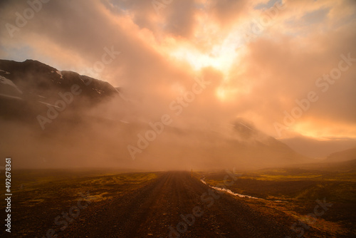 A misty and moody sunset on the mountain road to the to Mjóifjörður fjord, East Fjords, Iceland
