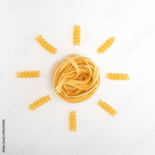 Creative flat lay pasta made yellow summer sun