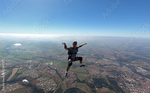 Relaxed and happy skydiver man on a summer day.