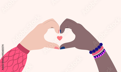 Sisterhood. Vector illustration in flat design. Black and white women connecting hands to heart shape
