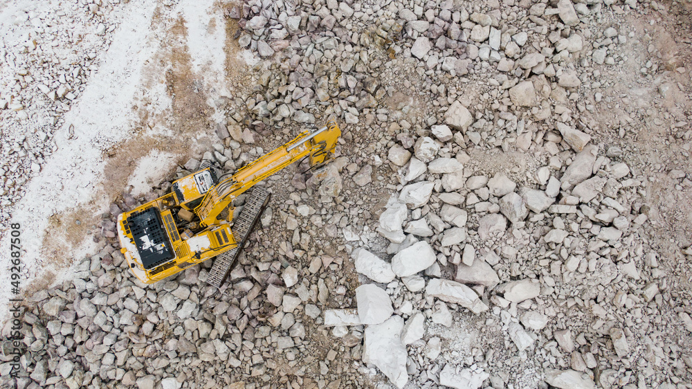 the excavator splits the stones. career equipment.