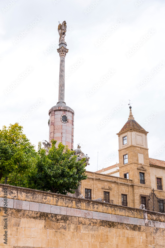 Obraz premium Column and statue commemorating the triumph of Saint Raphael situated in Plaza del Triunfo, Cordoba