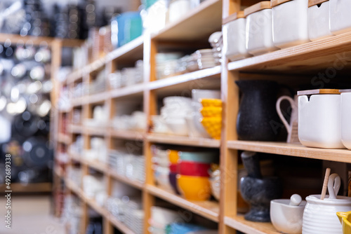 Shelves with assorted dishware at household goods store