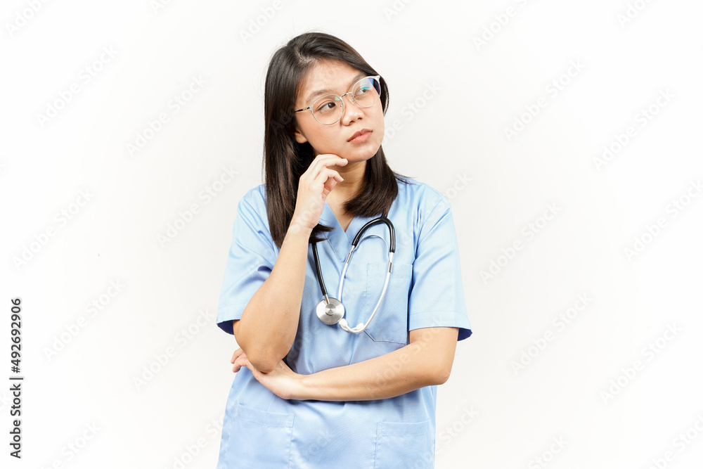 Thinking and Curious Of Asian Young Doctor Isolated On White Background Thinking and Curious Of Asian Young Doctor Isolated On White Background