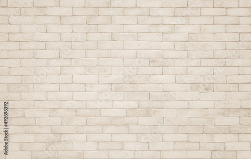 Beige brick wall texture background. Brickwork and stonework flooring backdrop interior design home decoration.