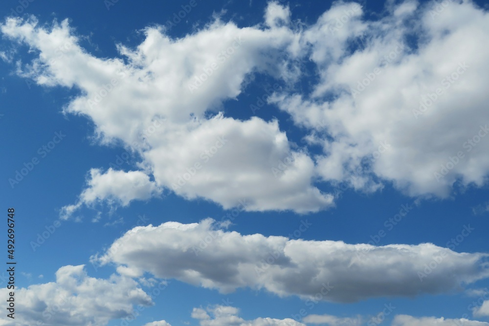 Blue sky with beautiful white fluffy clouds Blue sky with beautiful white fluffy clouds