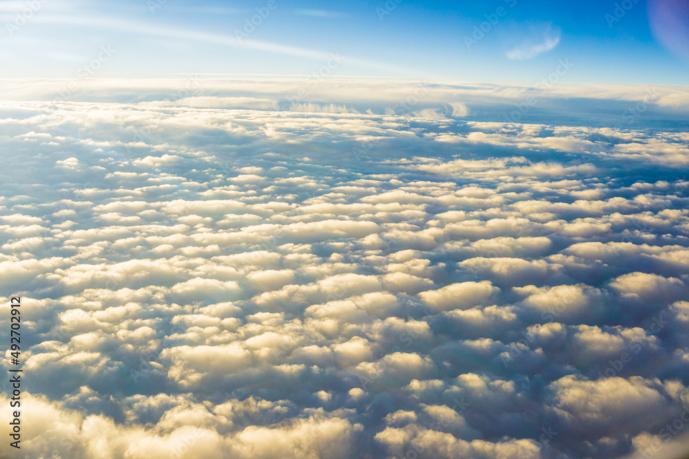 Fluffy cloud with blue sky aerial view from airplane Fluffy cloud with blue sky aerial view from airplane