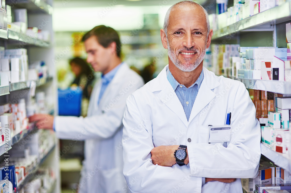 Your wellness is my main priority. Portrait of a confident mature pharmacist working in a pharmacy. Your wellness is my main priority. Portrait of a confident mature pharmacist working in a pharmacy.