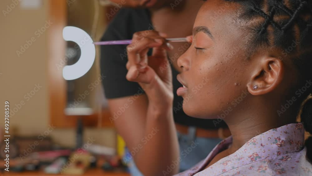 Makeup being applied to woman face