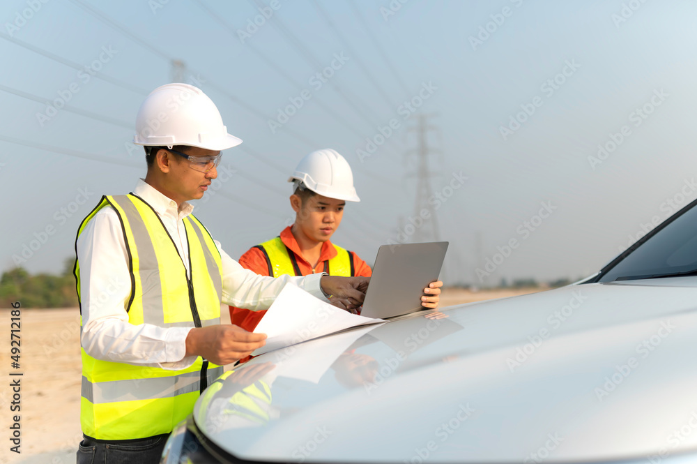 Architect at work in a construction site Engineers man construction safety work concept and construction city .Engineer Concept Architect at work in a construction site Engineers man construction safety work concept and construction city .Engineer Concept