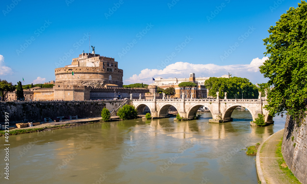 Castel Sant'Angelo mausoleum - Castle of the Holy Angel and Ponte Sant'Angelo bridge over Tiber river in historic city center of Rome in Italy