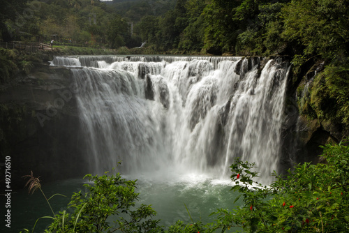 Scenic view of the Shifen Waterfall along the Keelung River in Pingxi District, New Taipei City, Taiwan. photo
