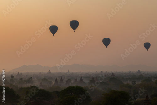 Beautiful view of hot-air balloons over temples and pagodas at the ancient plain of Bagan in Myanmar (Burma) at sunrise.