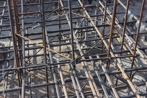 Reinforcement prepared for pouring a reinforced concrete foundation or grillage. Preparation of the base for pouring concrete. Reinforced concrete monolithic work at an industrial construction site.