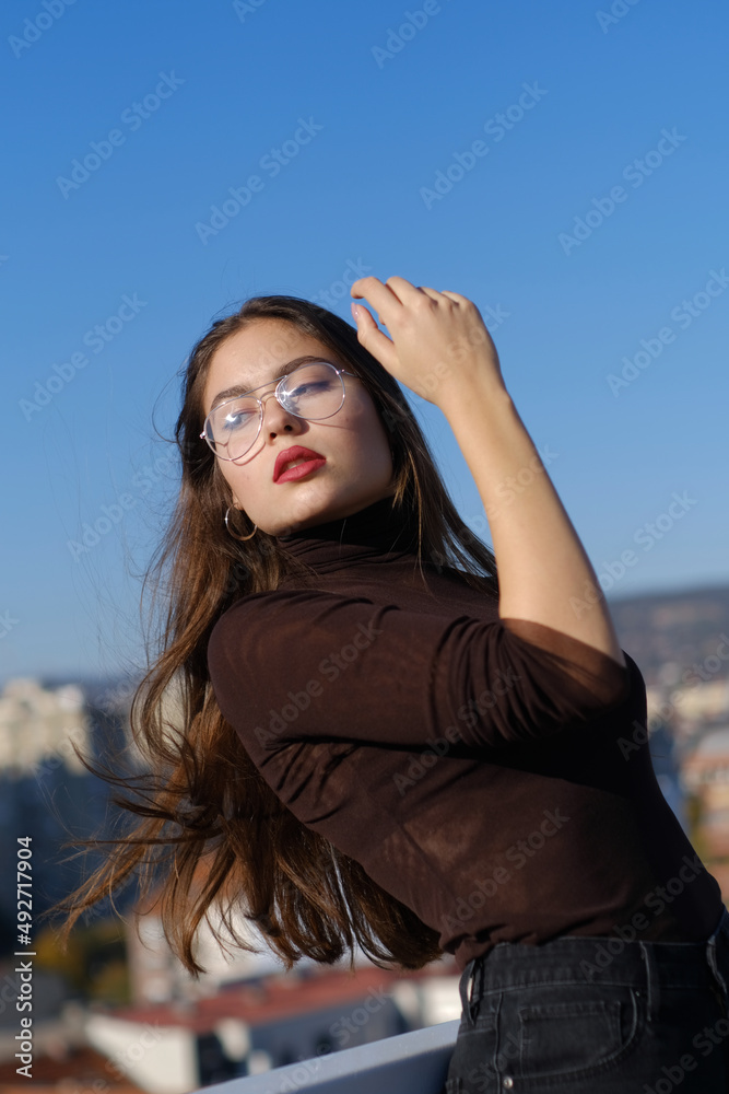 Urban attractive female portrait with long hair 