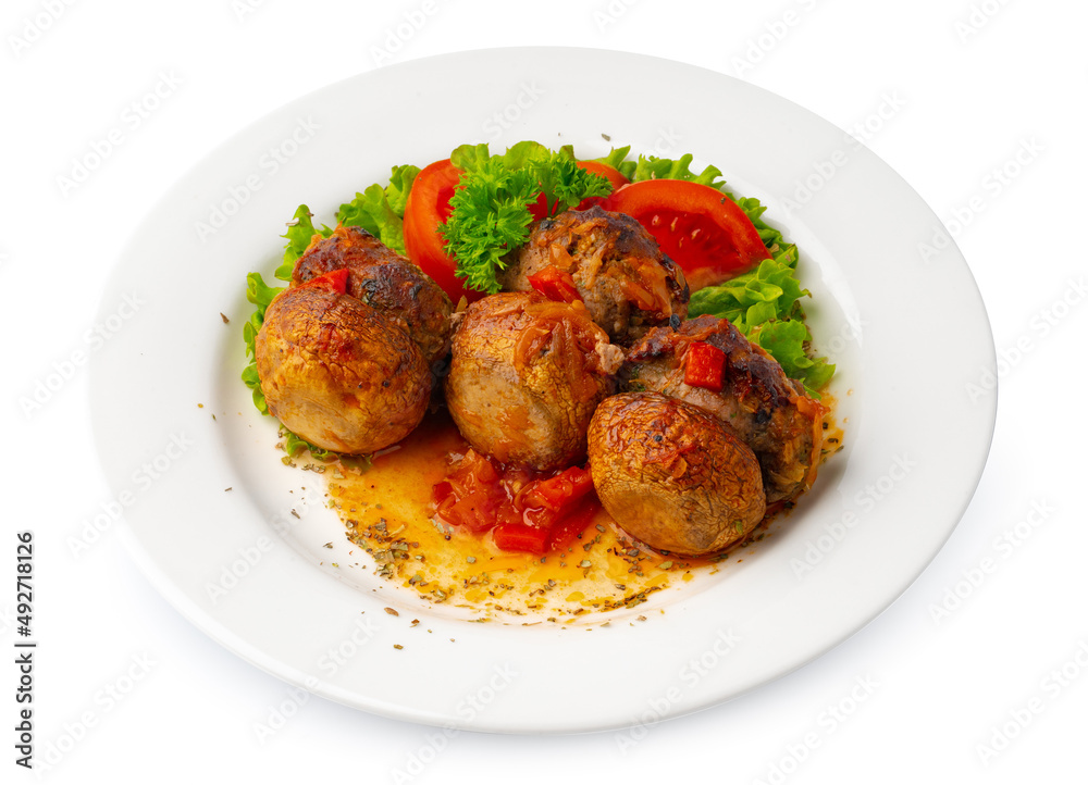 Meat balls with vegetables on white plate isolated on white Meat balls with vegetables on white plate isolated on white