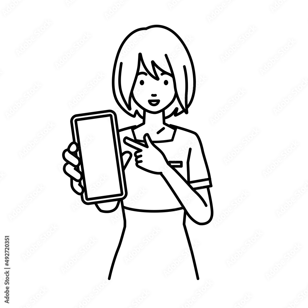 立ってスマートフォンを指差してこちらに向けて見せているエステ店員・受付・接客係の女性 立ってスマートフォンを指差してこちらに向けて見せているエステ店員・受付・接客係の女性