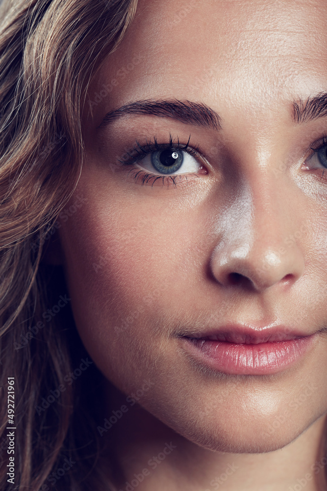 Fototapeta premium Flawless femininity. Portrait of a beautiful young woman in studio.