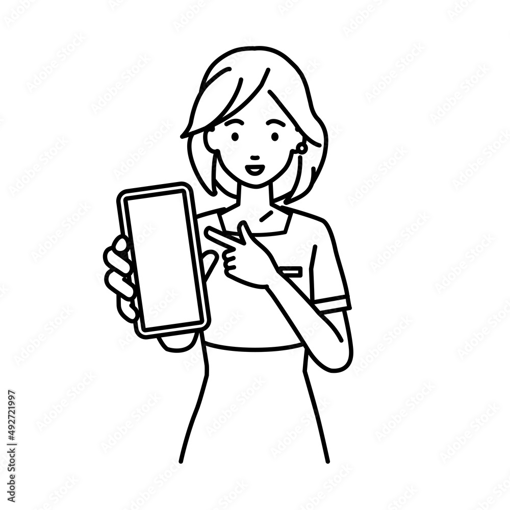 立ってスマートフォンを指差してこちらに向けて見せているエステ店員・受付・接客係の女性 立ってスマートフォンを指差してこちらに向けて見せているエステ店員・受付・接客係の女性