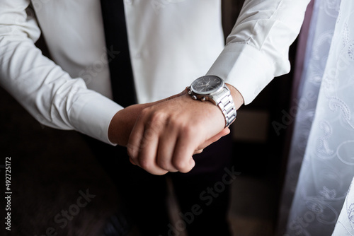 Portrait of a young male businessman. Groom on the wedding day. Wearing a business suit for an important interview.
