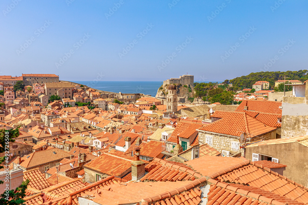 Aerial view on Dubrovnik walls in Croatia. View of Fort Lovrijenac fortress and church Crkva sv. Vlaho Saint Biagio of Dubrovnik UNESCO Venetian town of Croatia in Dalmatia