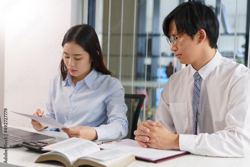 Business concept, Two business colleague checking financial data to brainstorm for new project Business concept, Two business colleague checking financial data to brainstorm for new project