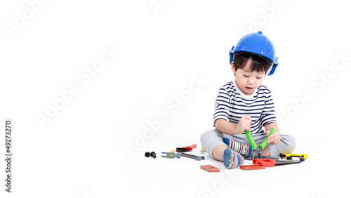 ittle boy playing act engineer, education concept.