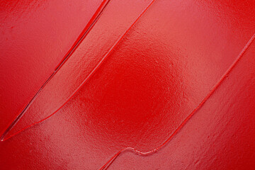 Lip gloss red colored smudge background texture