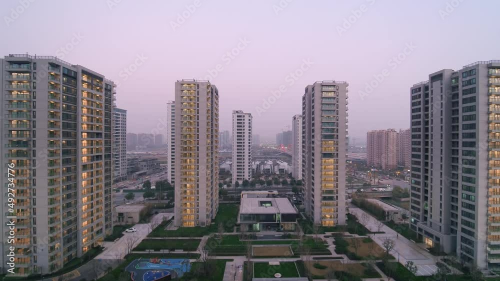 aerial view of high residential buildings at twilight
aerial view of high residential buildings at twilight