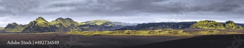 katla region Iceland, wide panorama of glacier and green mossy mountains photo